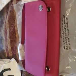 Lululemon crossberry clutch etc  bag tagged gorgeous maroon color gold accents